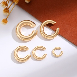 Five-piece set of golden C-shaped alloy ear cuffs in various sizes with high-polish finish