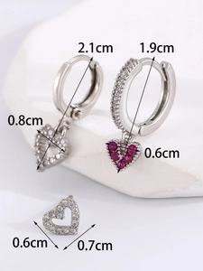 Macro shot of 14K gold-plated heart hoop earrings and studs with micro-pave cubic zirconia