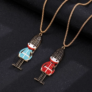 Close-up of sparkling rhinestone-encrusted British guard charms with vibrant enamel details