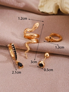 Detailed view of four 14K gold-plated snake earrings with black zircon and micro-inlays