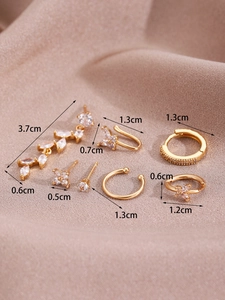 Detailed macro shot of a 6-piece 14K gold-plated earring set with zircon inlays and tassels