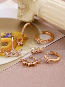 Detailed view of 5-piece 14K gold-plated earring set with micro-set sparkling zircons