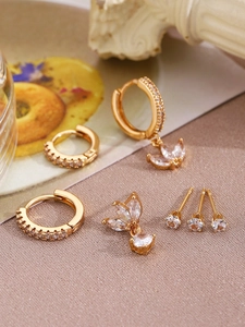 Detail of 14K gold-plated hoop earrings and stud set with micro-paved cubic zirconia