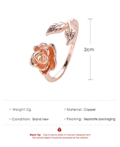 Macro detail of rose gold flower ring with copper rose petal and leaf design
