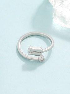 Detail of silver tulip flower open ring with sparkling round cubic zirconia stone