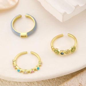Three-piece set of adjustable gold rings with colorful enamel and zircon stones
