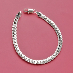 Detail of silver chain bracelet with textured links and a secure lobster clasp