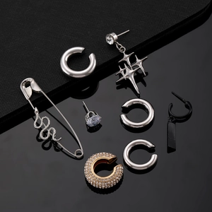 Ensemble détaillé de boucles d'oreilles punk avec manchettes, serpent et motifs d'étoiles