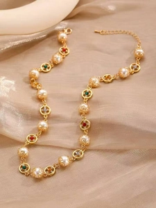 Macro detail of Baroque style necklace with multi-colored crystals and faux pearls