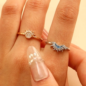 Matching sun and moon couple rings set with rose gold and silver finishes and zircon stones