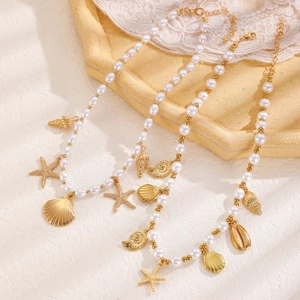 Bohemian pearl necklace set with gold starfish shells and conch pendants for beach vacations