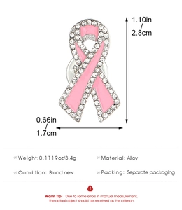 Detailed view of pink ribbon brooch with crystals showing 2.8cm and 1.7cm dimensions