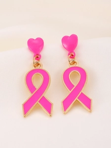Close-up of pink ribbon heart earrings with gold base for breast cancer awareness
