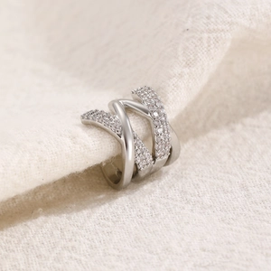 Close-up of silver multilayer crisscross ear cuff with micro-pave cubic zirconia