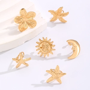 Golden alloy earring set with sea star flower sun and crescent moon charms