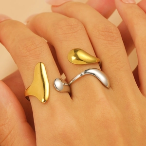 Water wave open ring set in gold and silver finish with minimalist melting metal design