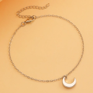 Detail view of silver O-chain necklace featuring minimalist crescent moon pendant and clasp