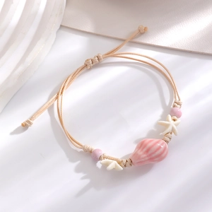 Handmade ocean style woven starfish bracelet with pink ceramic conch on beige cord