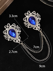 Detailed view of vintage silver chain brooch with blue teardrop crystals and measurements