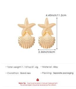 Detailed view of large gold starfish and shell earrings with dimensions and 31.4g weight