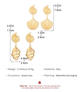 Detailed view of large gold alloy starfish and conch earrings with precise dimensions