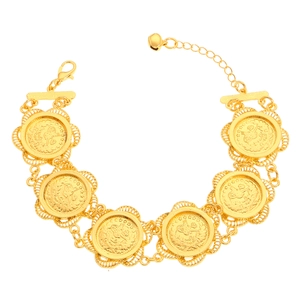 Detail of vintage gold coin bracelet featuring hollow lace edges and small bell charm