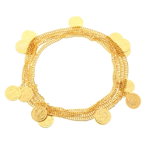 Detail of vintage gold multilayered chain jewelry with intricate coin charms and motifs