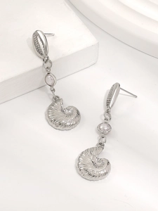 Detailed view of silver sea shell earrings with white pearl and nautilus shell pendant