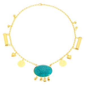 Detail of bohemian gold layered necklace with green turquoise and metal charms