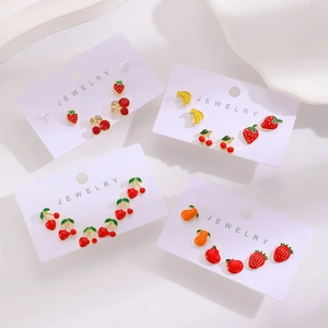 Detail of colorful fruit earring set featuring alloy drip oil strawberry and cherry designs