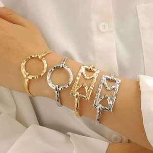 Exaggerated alloy cross heart bangles with hammered texture in gold and silver finish