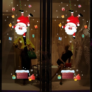 Adesivi natalizi per finestre con Babbo Natale nel camino e decorazione di fiocchi