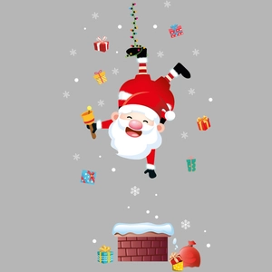 Dettaglio macro dell'adesivo di Natale con Babbo Natale capovolto e scatole regalo colorate