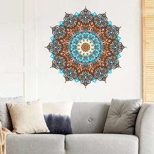 Blue mandala wall sticker over gray sofa in a modern bohemian style living room decor