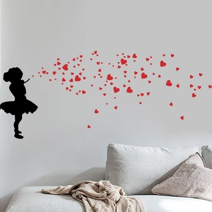 Creative wall sticker featuring a little girl blowing red hearts for home wall decor