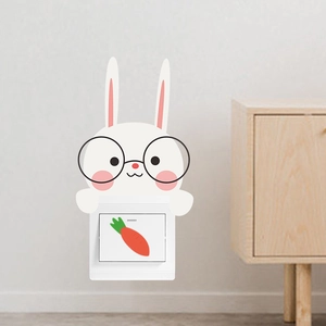 Cute cartoon rabbit wall sticker decoration on a white light switch with carrot decal