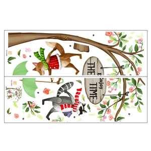 Detail view of fox and raccoon forest wall stickers with ENJOY THE TIME sign