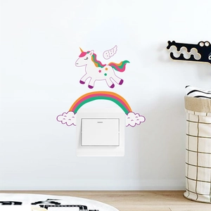 Close-up of cute cartoon unicorn and rainbow wall stickers decorating a light switch panel