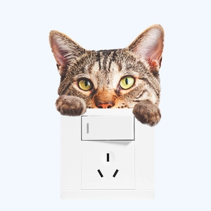 Detailed realistic brown tabby cat wall sticker placed above a white light switch panel