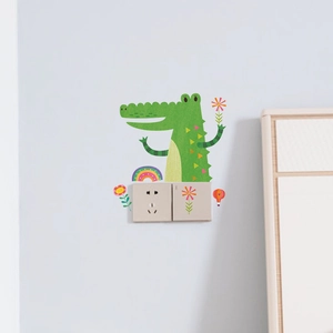 Detailed view of a green cartoon crocodile wall sticker for creative switch decoration