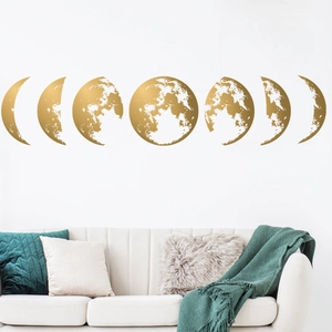 Golden moon phase wall stickers set of 7 for minimalist home decor above a white sofa