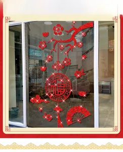 Detail of red glitter Lunar New Year Fu window sticker with plum blossoms and tassels
