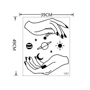 Detail of creative black and white wall sticker showing hands holding planets and stars