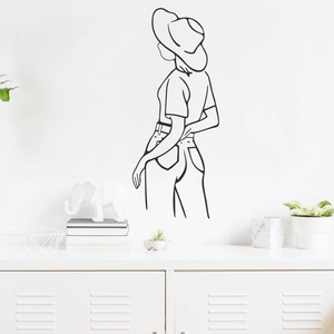 Minimalist black line art wall sticker showing a woman back view on white living room wall
