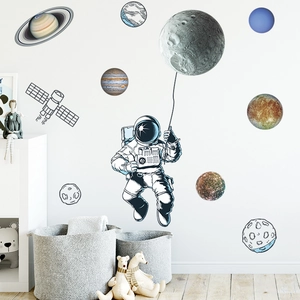 Space astronaut and planet wall stickers for nursery decor in blue and warm yellow tones