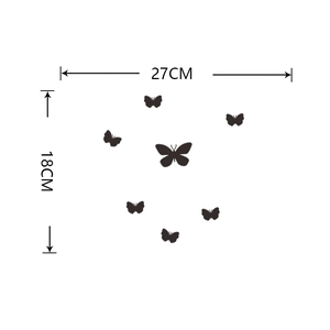 Detail view of 7 black butterfly wall stickers with size labels 27cm x 18cm