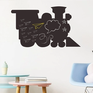 Detail of train shaped blackboard wall sticker with decorative chalk drawings on surface
