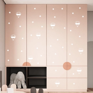 White star and hot air balloon wall stickers for nursery decor on pink furniture