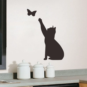 Black PVC wall sticker featuring a sitting cat silhouette chasing a butterfly on a white wall