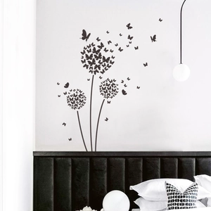 Modern black dandelion and butterfly wall decal for a minimalist bedroom decoration